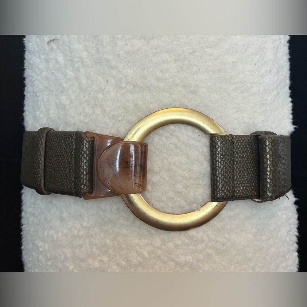 Chico’s adjustable belt with metal and tortoise shell clasp.
